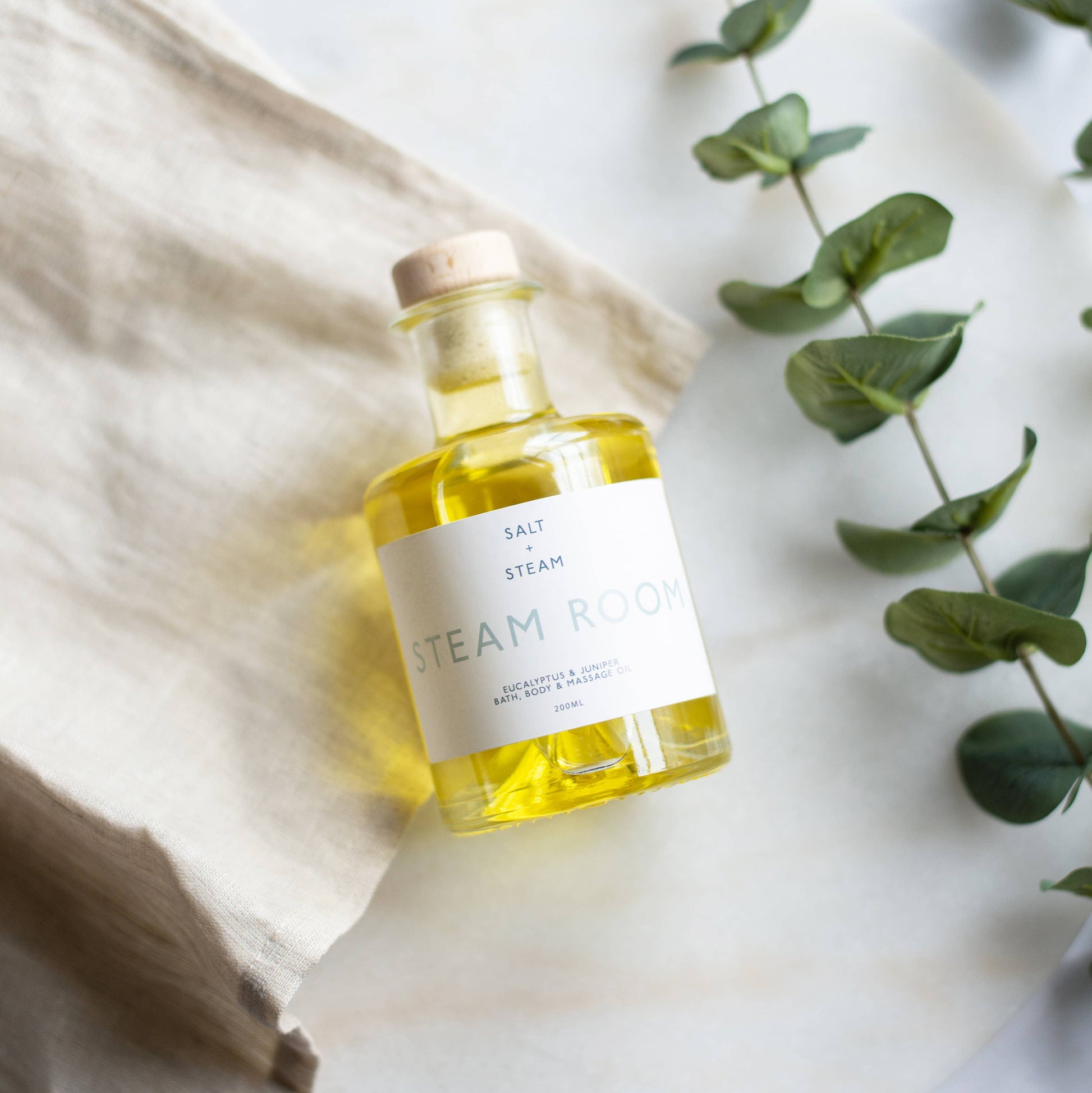 Steam Room eucalyptus juniper oil used for massage, bath, and daily skin hydration.