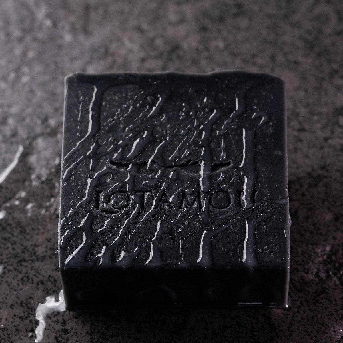 Vegan-friendly Dark Patchouli soap bar wrapped in branded paper