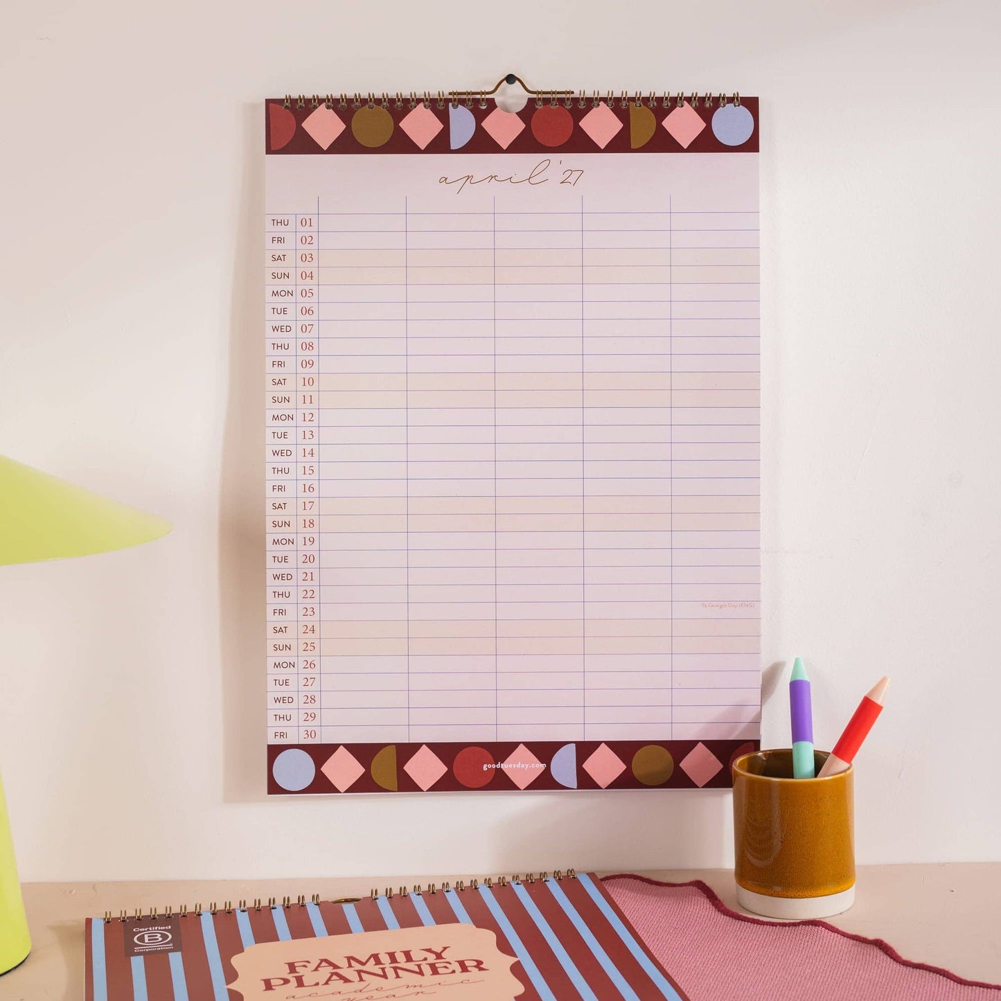A3 family academic calendar hanging on a wall showing circus theme
