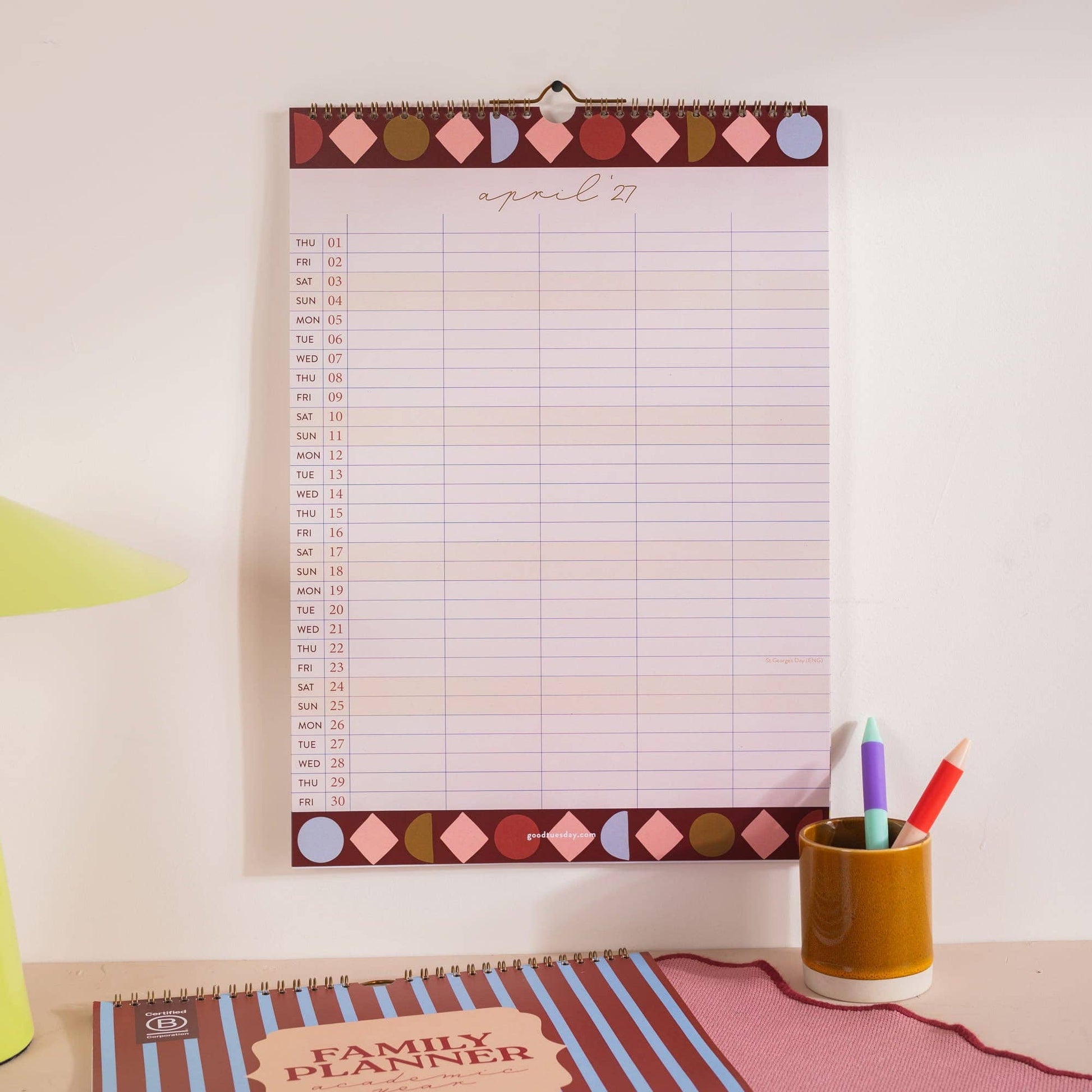 A3 family academic calendar hanging on a wall showing circus theme