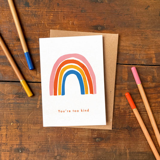 A6 thank you greeting card with colourful rainbow illustration and ‘You’re Too Kind’ text, printed on matte card with recycled kraft envelope.