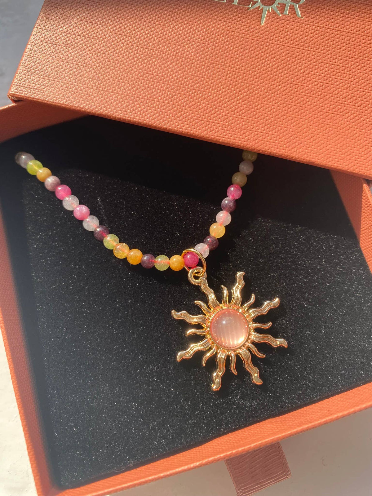 Multicolour bead necklace with an 18k gold-plated stainless steel sun charm