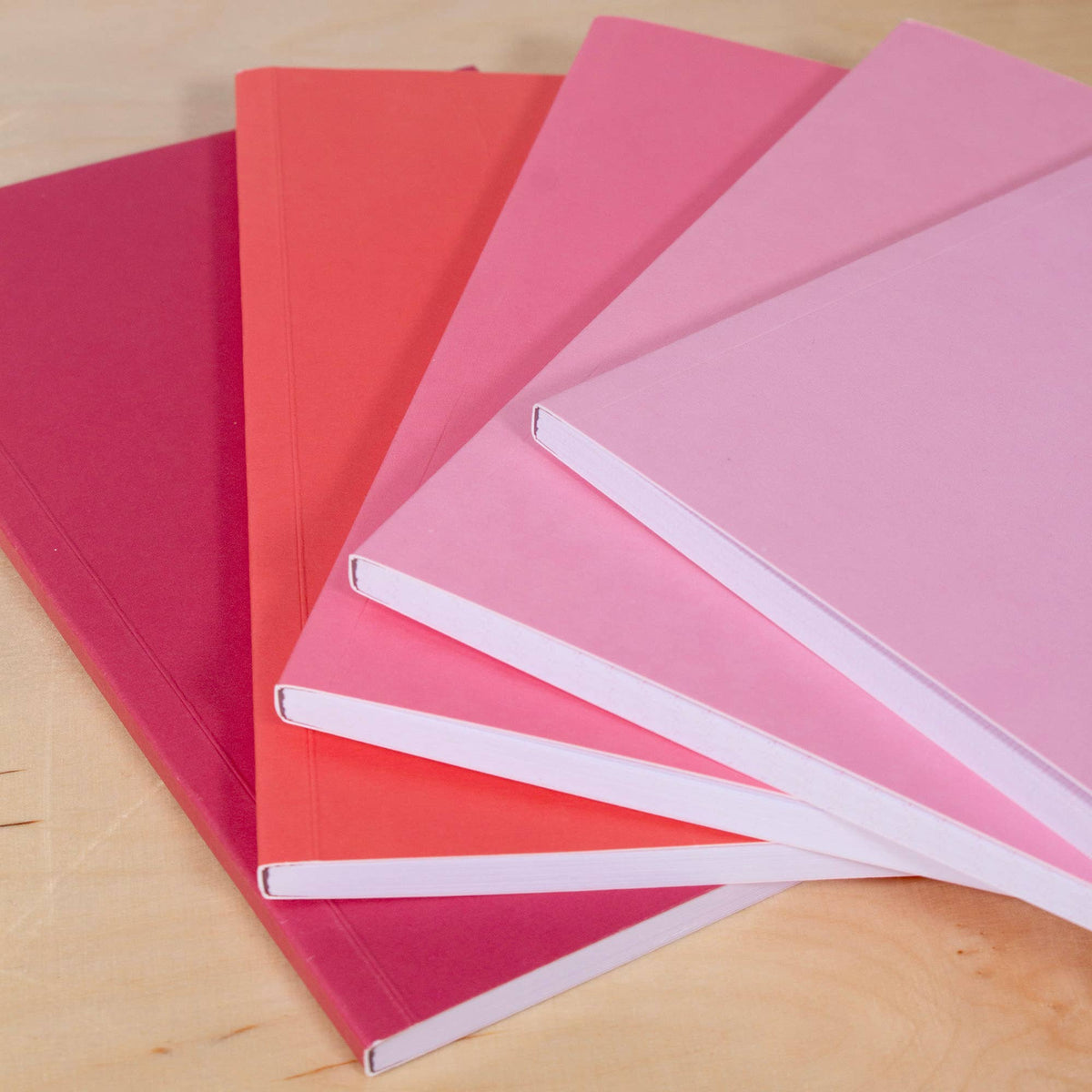 Gradient A5 notebooks in colourful display for gift idea