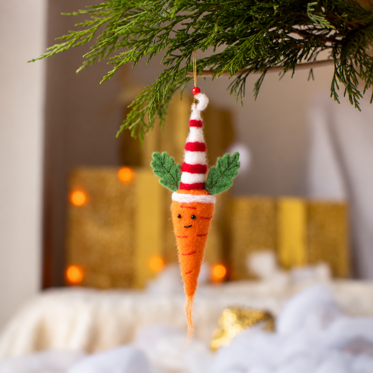 Close-up of handmade organic wool needle-felted Colin Carrot decoration