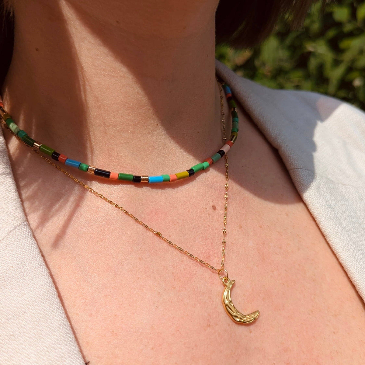 Close up of the tarnish-free gold plated moon pendant