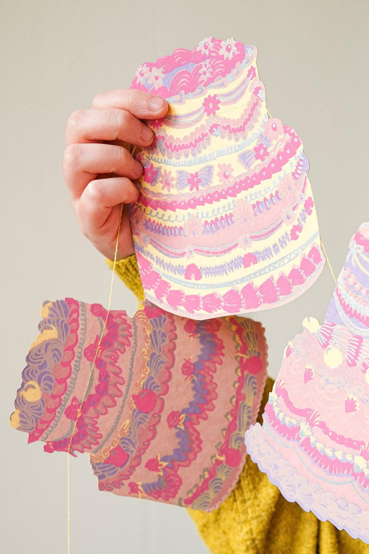 Colourful birthday celebration cakes sewn banner