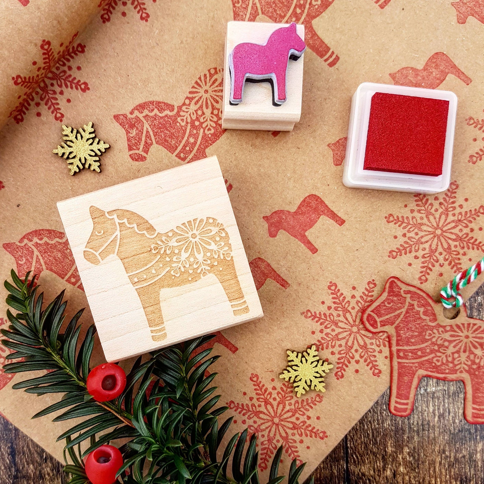 Nordic Dala Horse Christmas Rubber Stamp on eco-friendly wooden block, handmade in Devon, UK, perfect for sustainable Christmas card making and gift wrapping