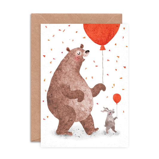A6 greeting card showing a hand-collaged bear and bunny dancing illustration by Emily Nash, blank inside, paired with a recycled kraft envelope.