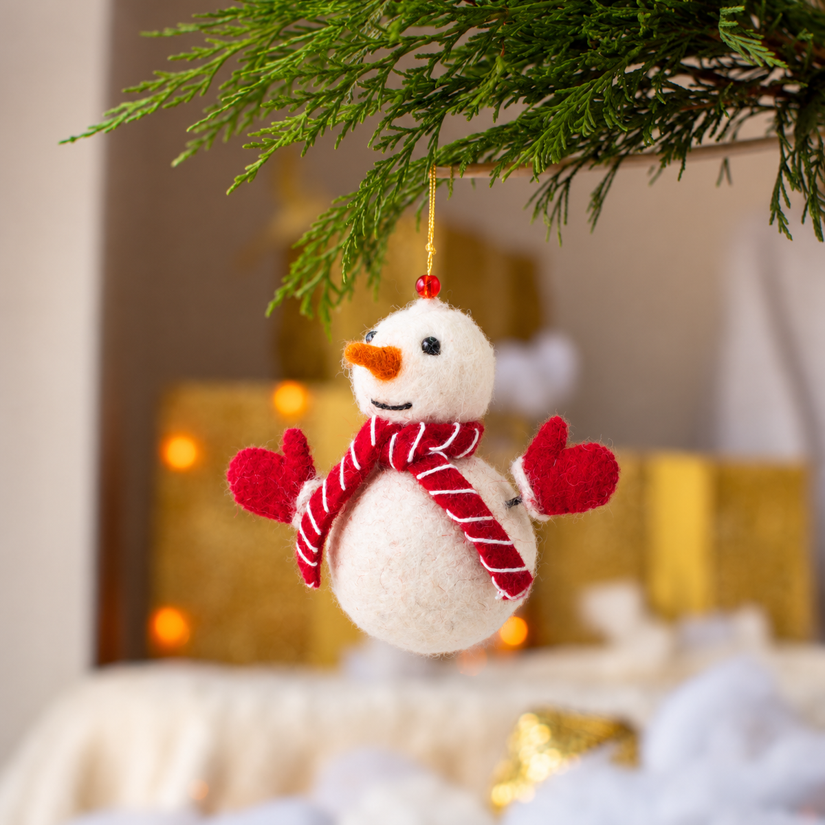 Close up of needle felted organic wool snowman decoration