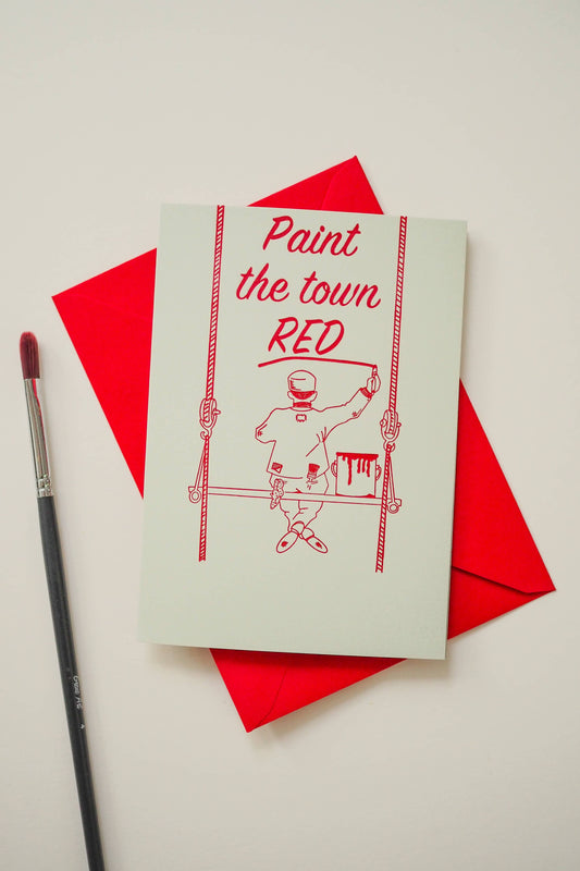 Close-up of the letterpress detail on the 'Paint The Town Red' celebration card, showing texture