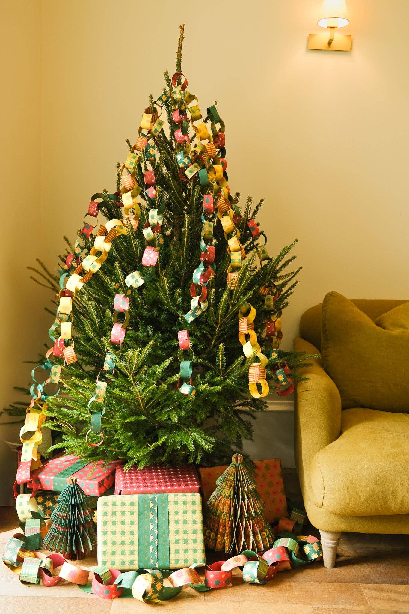Recycled festive paper chain strips, hand-printed double-sided, eco-friendly decoration kit.