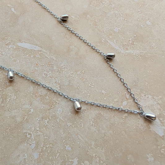 Everyday Silver Mini Droplet Necklace worn by a model