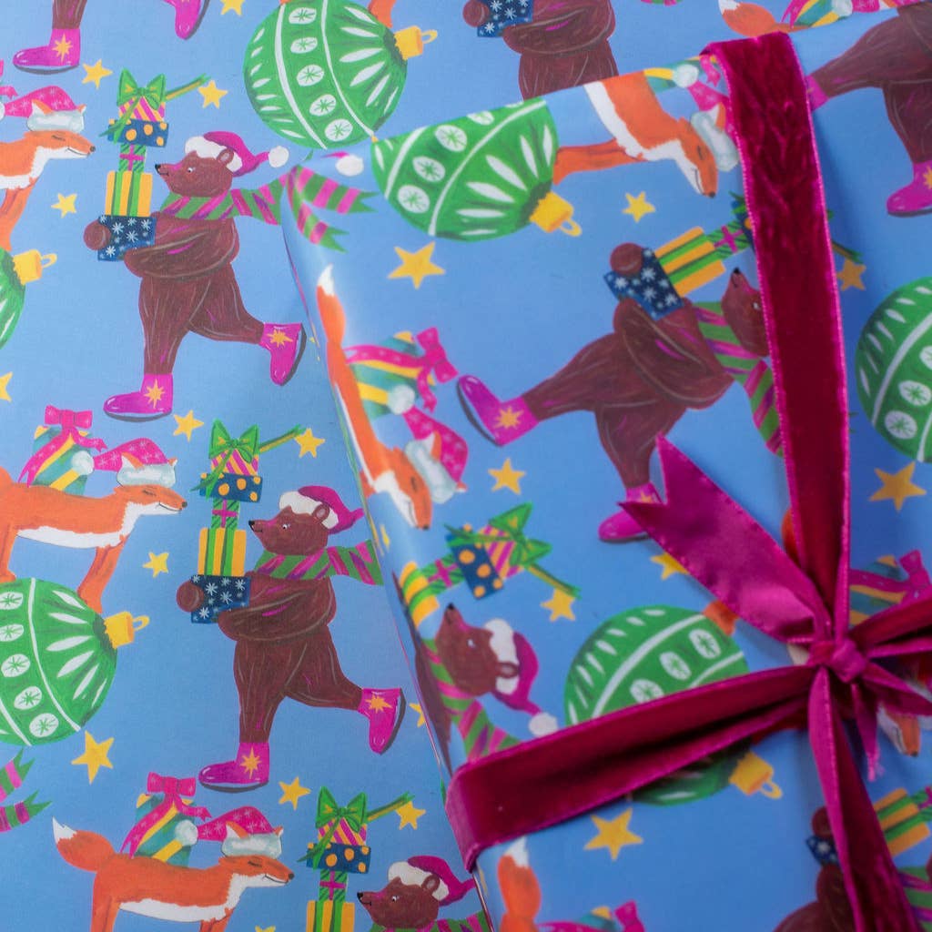Sustainably sourced festive wrapping paper featuring hand-illustrated fox and bear