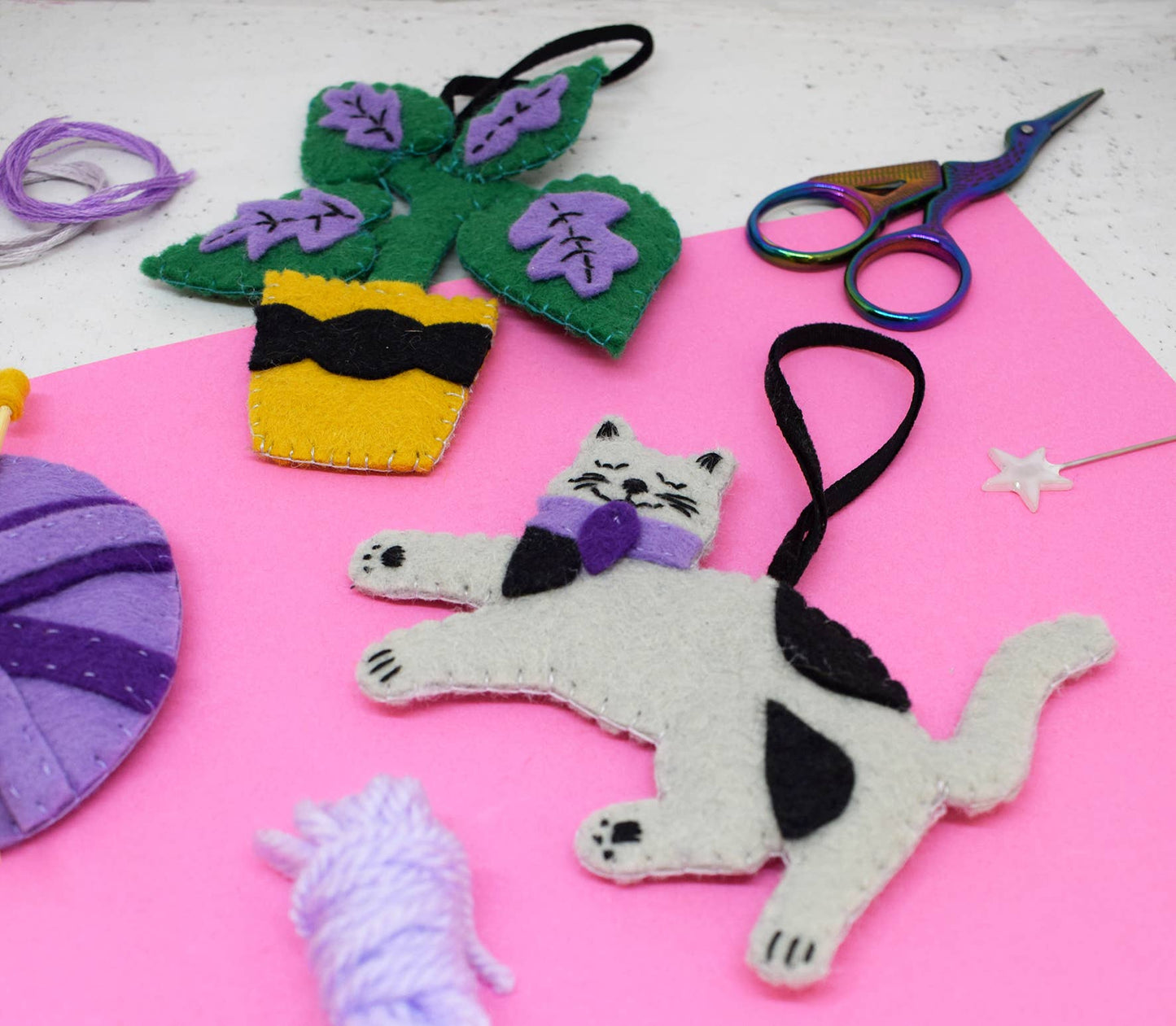 Crafty Cats Felt Stitching Set. Three felt hanging decorations. A cat, a ball of wool and a plant.