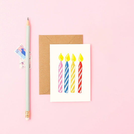 Mini birthday card featuring five colourful hand-drawn candles with smiling faces