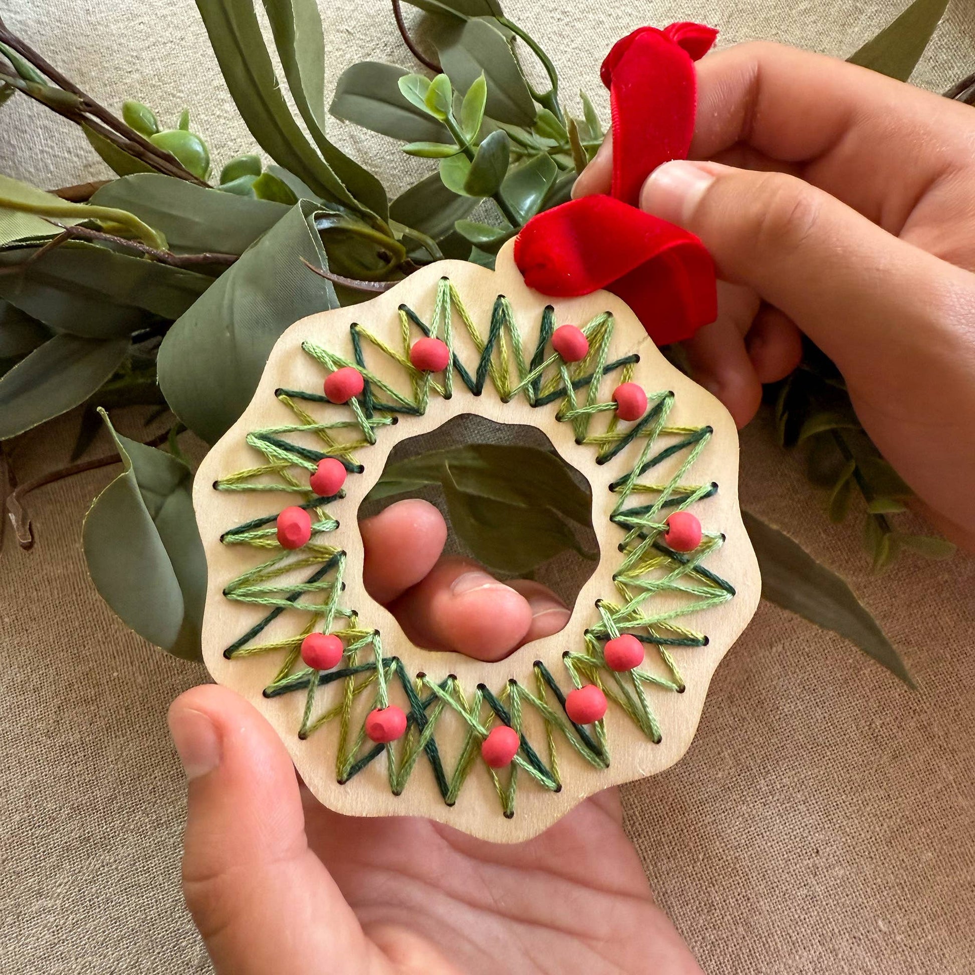 Cotton Twist stitched wreath decoration kit with sustainably certified wooden wreath and cotton thread