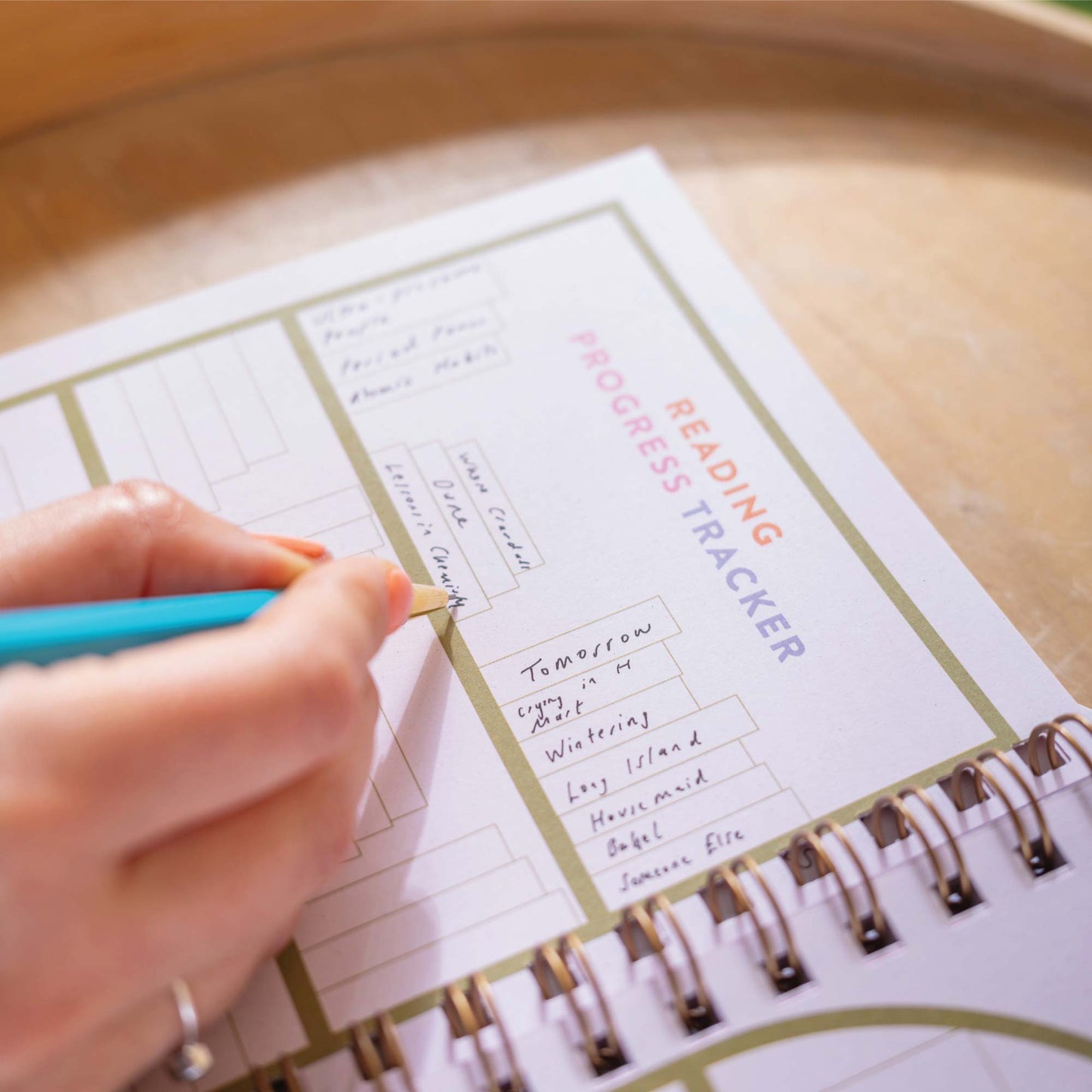 Stack of A5 Book Nook Reading Journals, showcasing the vibrant cover design