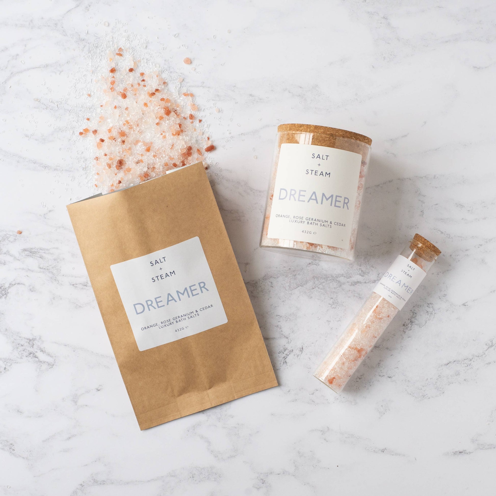 Floral and woody scented vegan bath salts in plastic-free packaging.