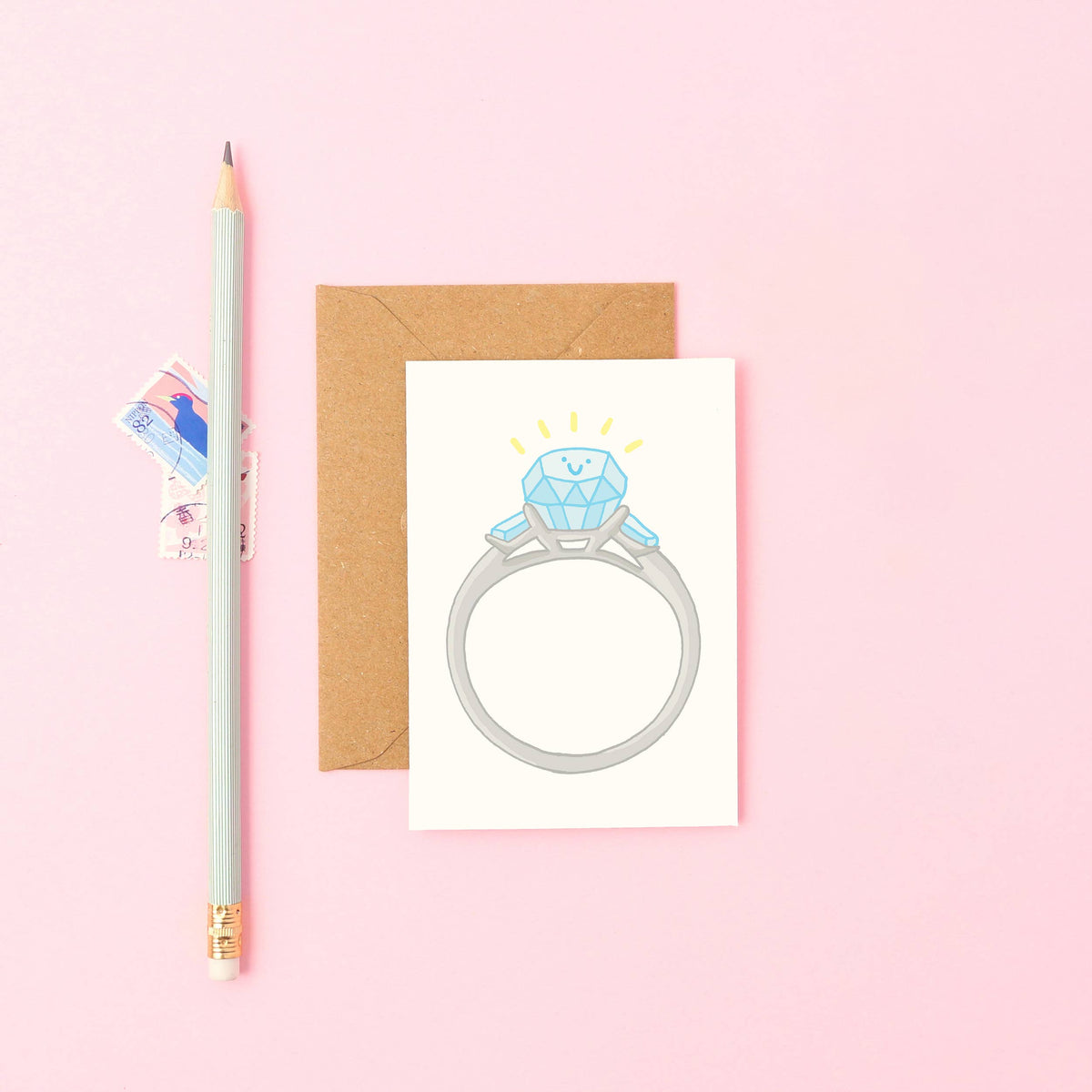 Cute hand-drawn smiling engagement ring mini congratulations card with Kraft envelope