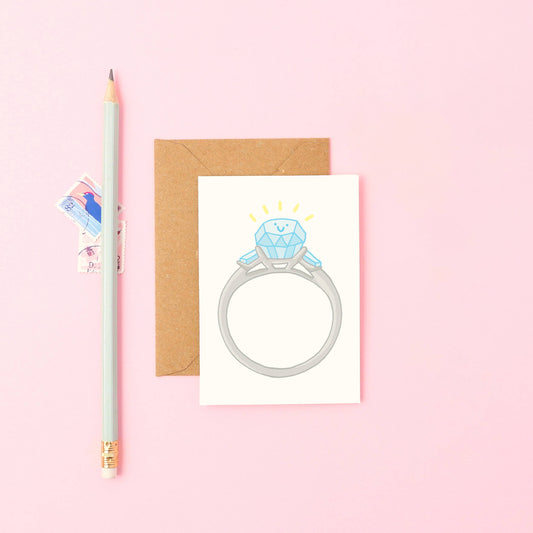 Cute hand-drawn smiling engagement ring mini congratulations card with Kraft envelope