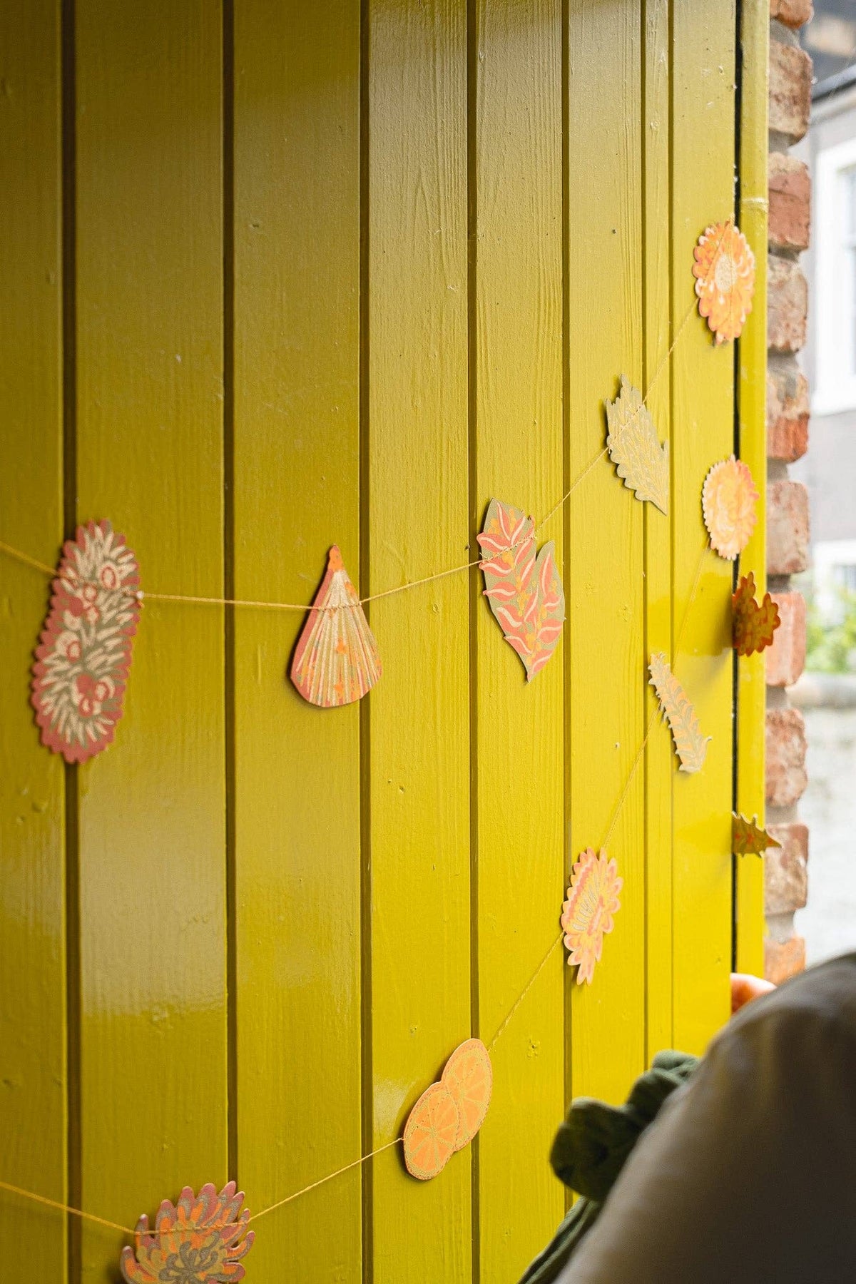 Handmade autumn floral garland hanging on a wall