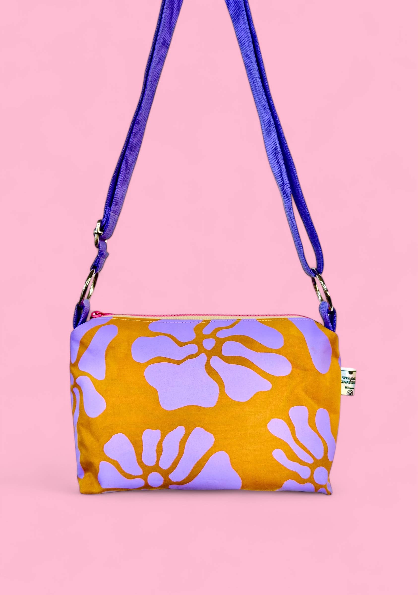 Floral lilac and ochre waxed canvas boxy crossbody bag, handprinted with eco-friendly water-based inks, fully lined and padded interior with phone pocket