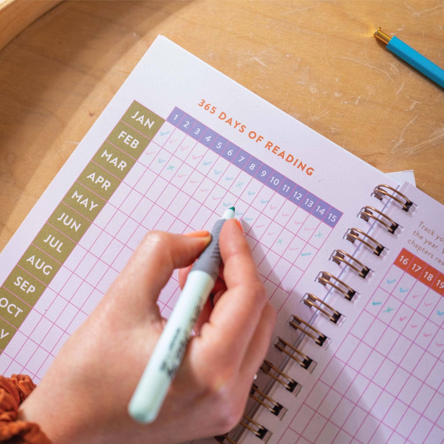 A5 Book Nook Reading Journal styled with a pen and reading accessories