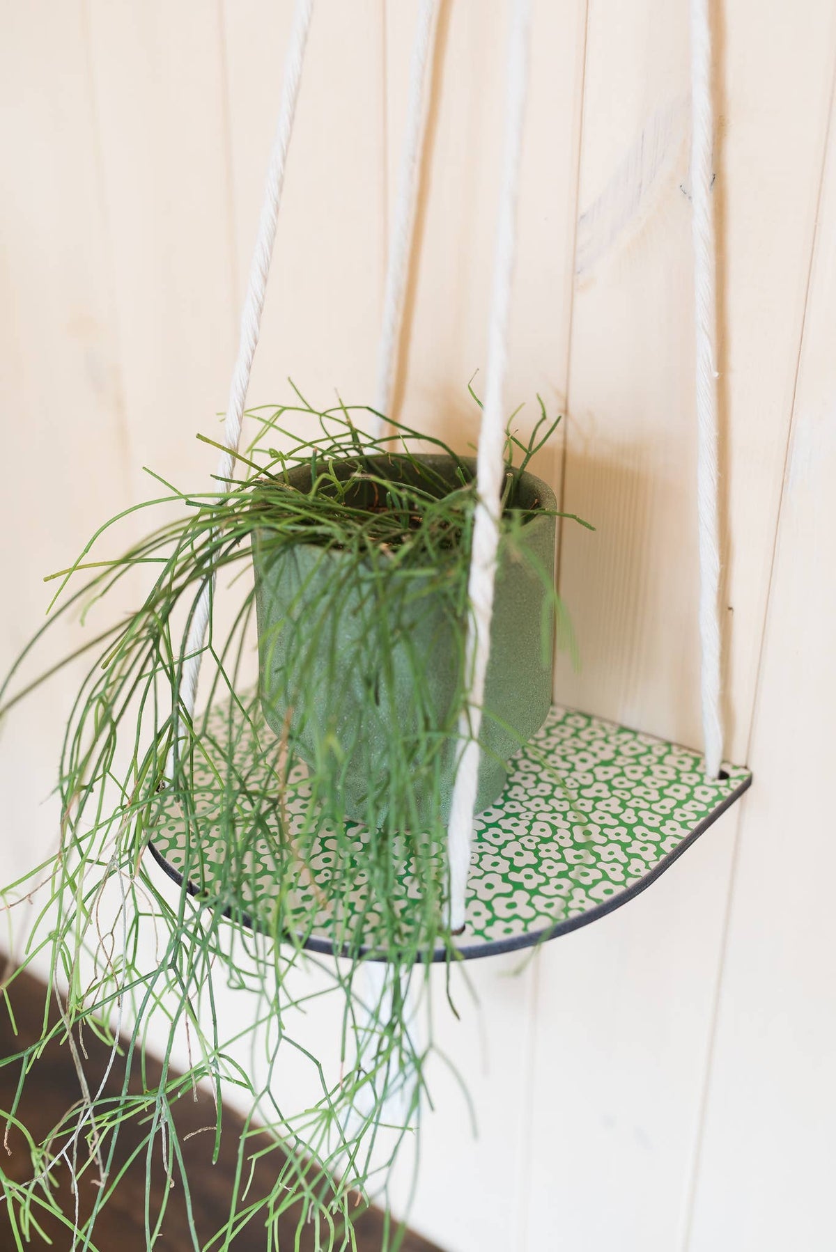 Sustainably sourced maple wood plant shelf with green floral pattern