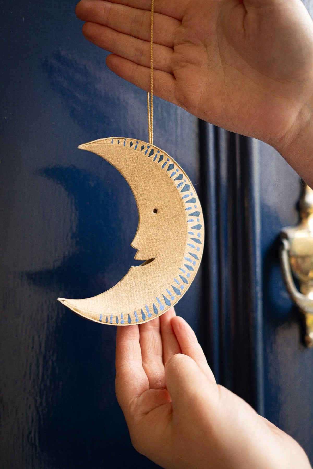 Golden Man on the Moon hanging ornament showing 10cm cotton loop