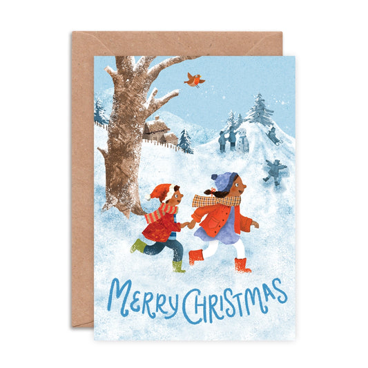 A6 Christmas card featuring an illustrated wintry street scene with people walking through snow, designed by Emily Nash, printed on eco-friendly matte card with kraft envelope.
