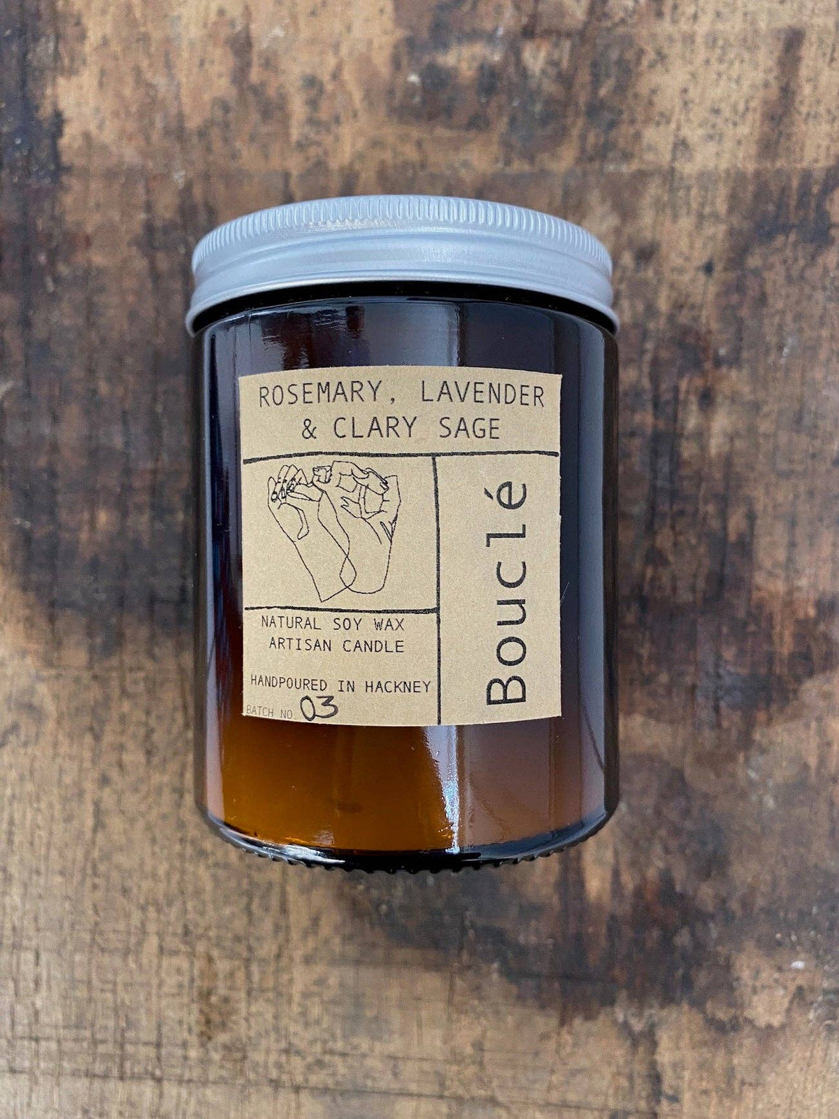 Sustainably sourced soy candle with amber jar and black lid