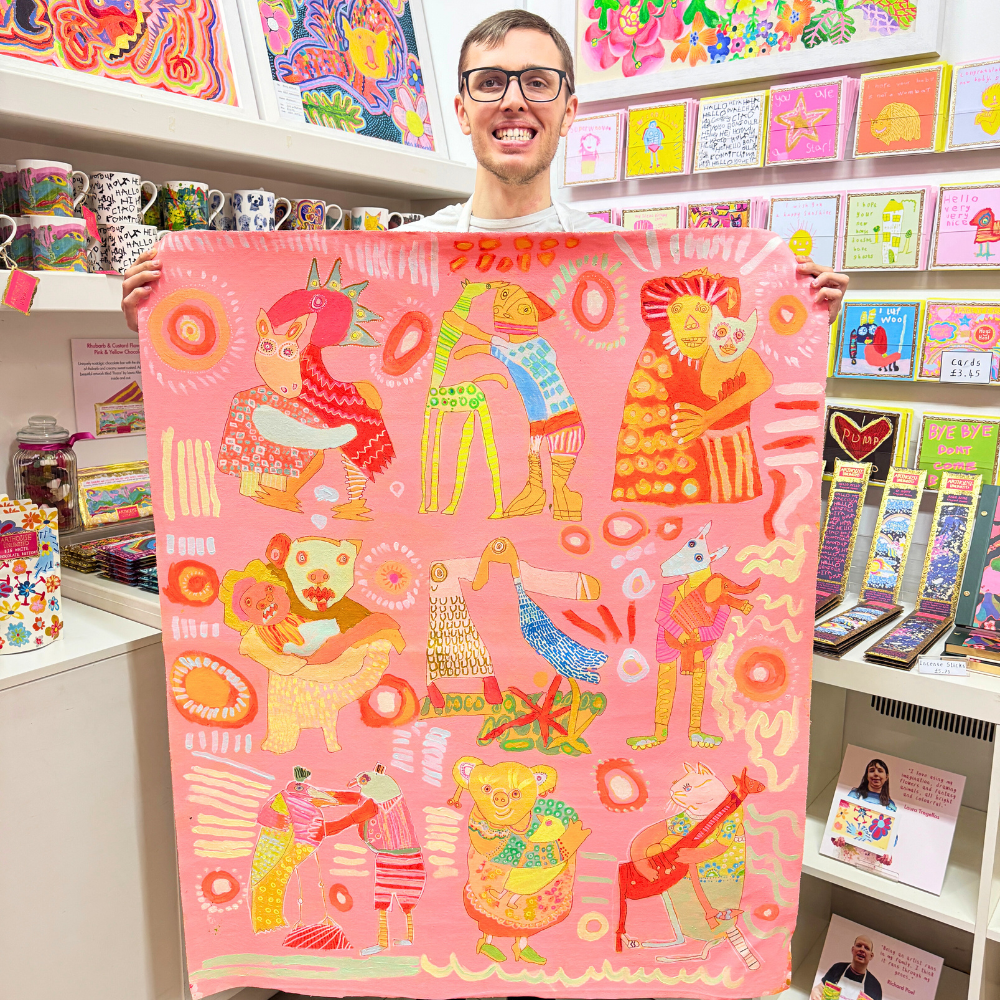 Hugging Animals tea towel draped, showcasing 100% organic cotton texture