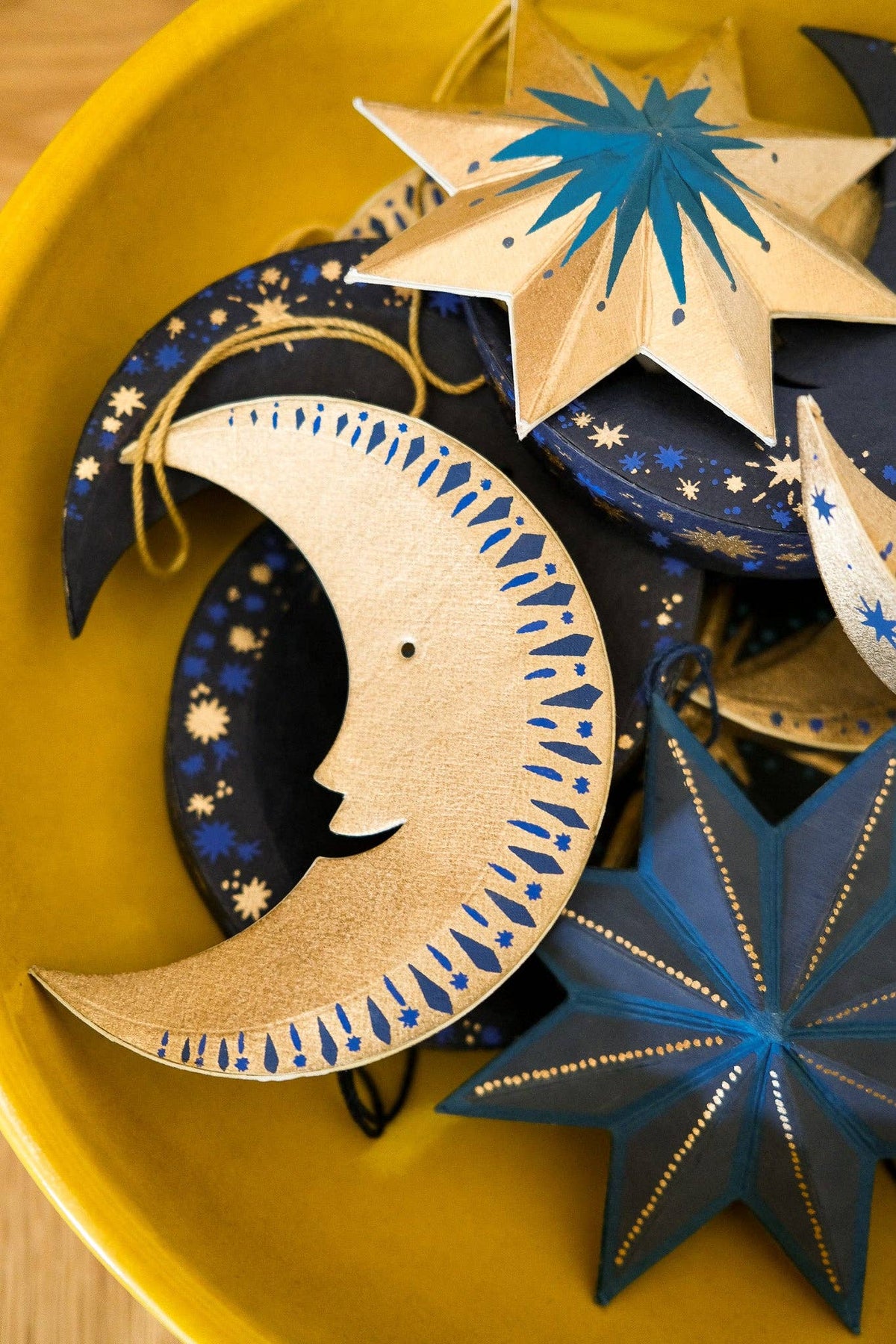 Reverse side of screen printed golden Man on the Moon decoration