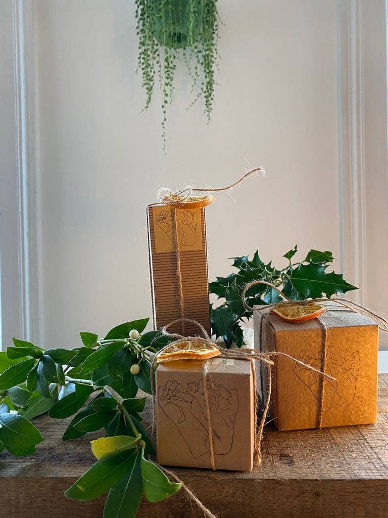 Eco-friendly winter candle on a wooden table
