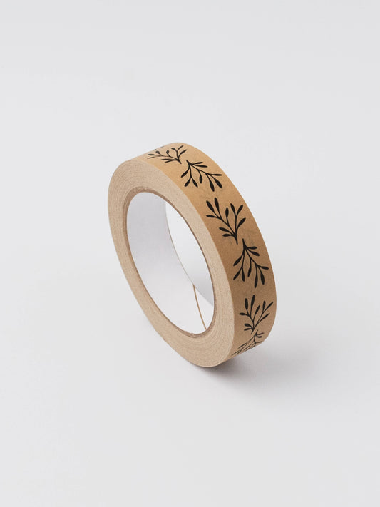 Roll of floral kraft paper tape with intricate botanical pattern