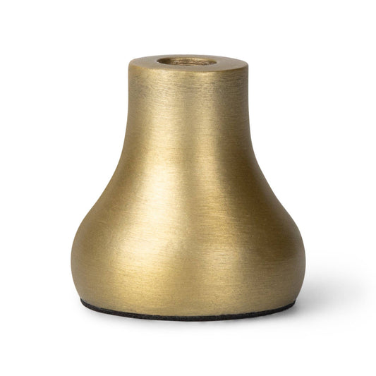 Close up of a single gold cast aluminium mini candleholder