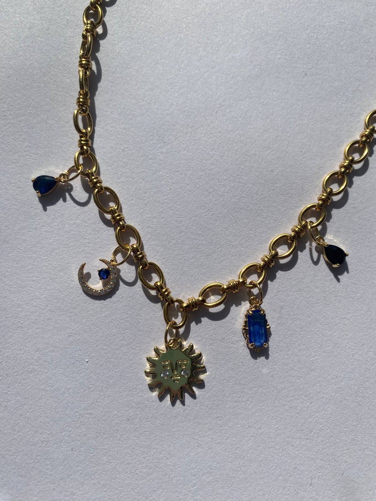 Gold celestial charm necklace in sustainably sourced eco packaging