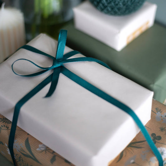 Dark green biodegradable Tencel ribbon 9mm, 5m reel, certified compostable, sustainably sourced, cardboard reel.
