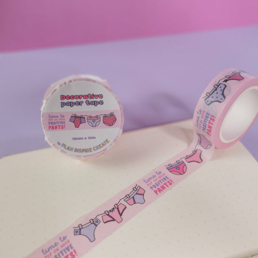 	Pink and purple patterned pants washi tape with “pop on your positive pants” message and eco-friendly paper packaging—perfect for uplifting journaling and craft projects.
