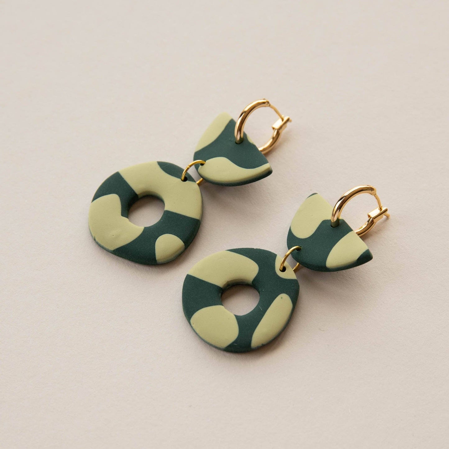 Close up of gold plated nickel free hoops on clay earrings