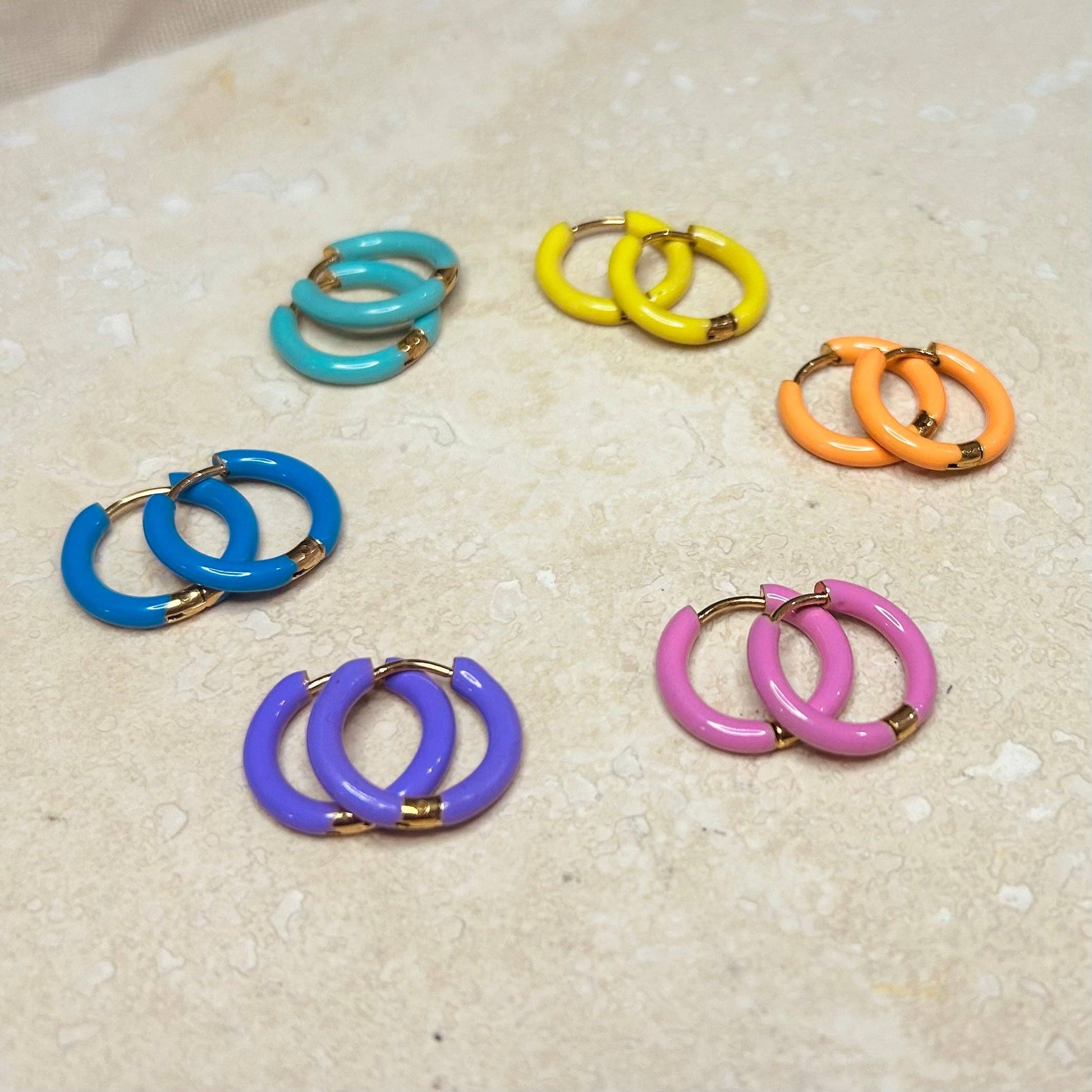 Candy Enamel Hoops, with gold plated fixings. 6 colours available, blue, green, yellow, orange, pink, lilac. 17mm wide with comfortable hinge click fastening 