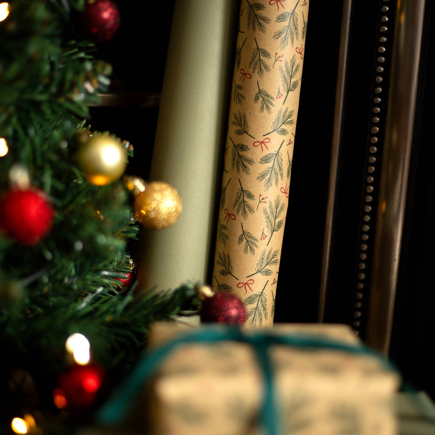 Festive Branches & Bows Christmas Gift Wrap, 5m roll, 500mm wide, 100% recycled brown kraft, eco-friendly sustainable wrapping paper.