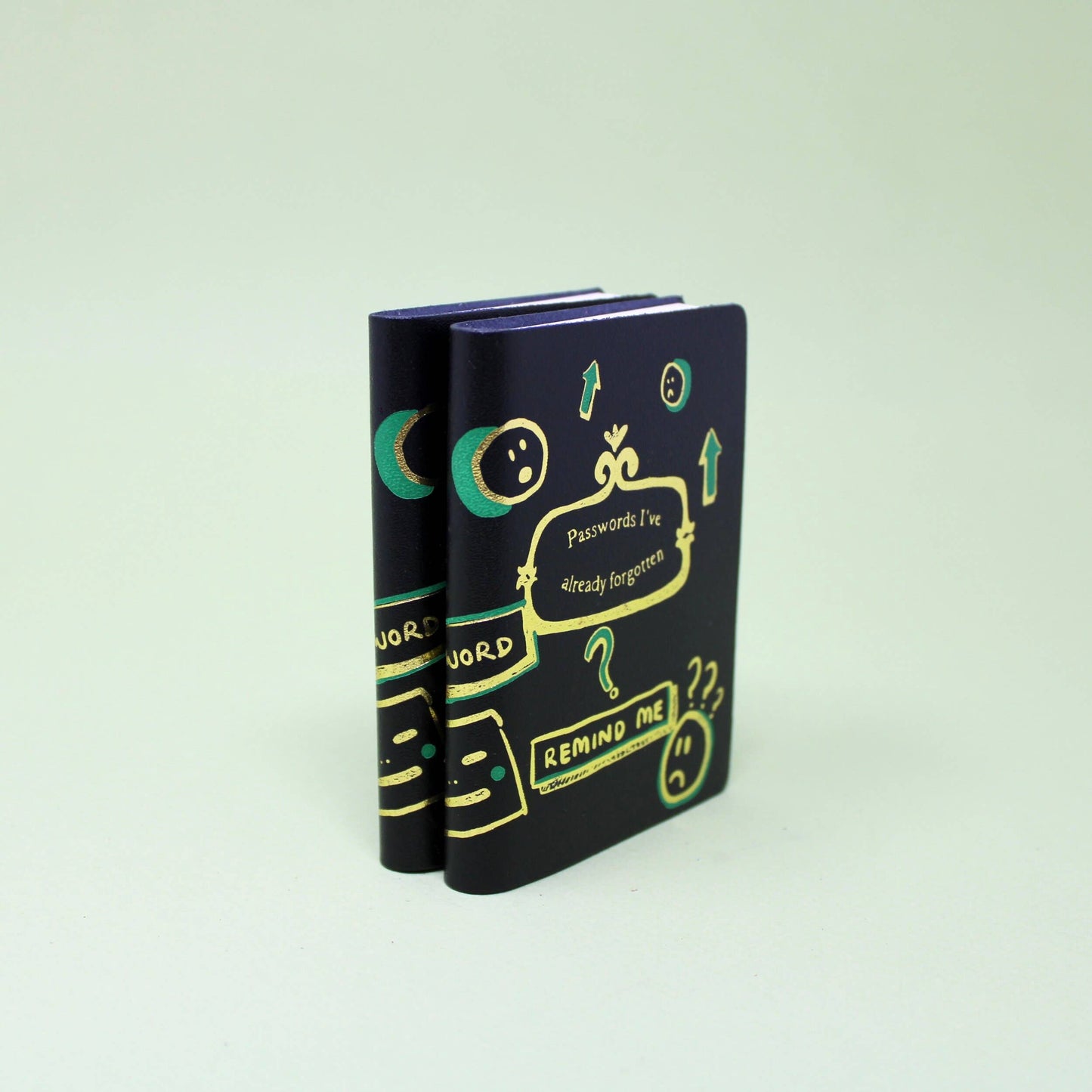 Midi leather journal with gold foil illustration, handmade in Scotland using ethical leather by Ark Colour Design. Black leather gold embossed Passwords I've already forgotten.
