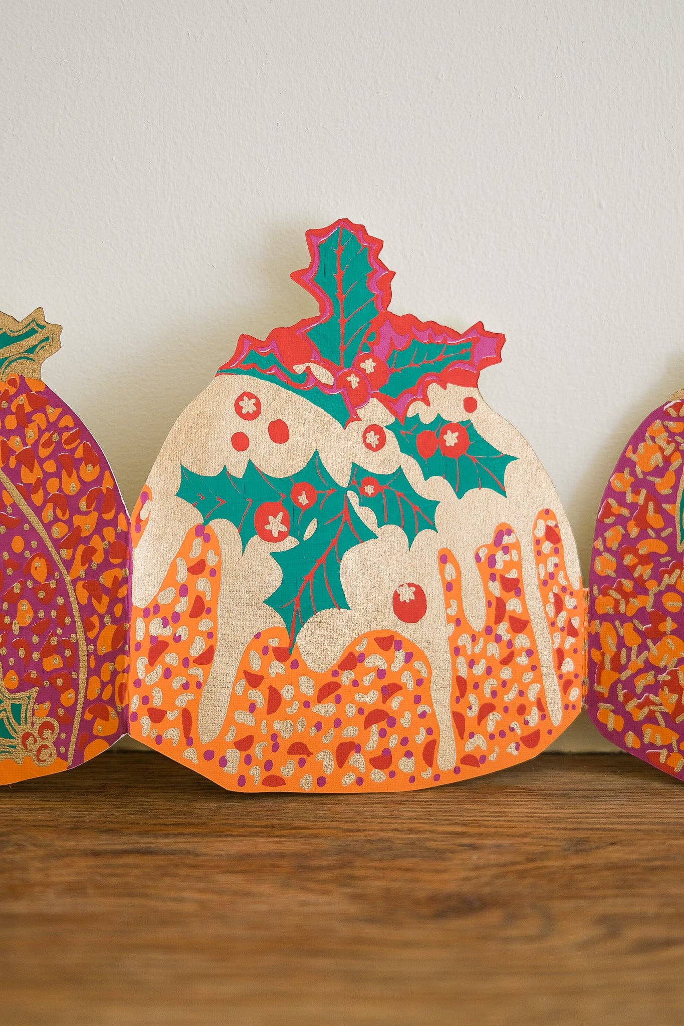 Hand-printed recycled paper Christmas Puddings Concertina Garland by East End Press, 3 metres long