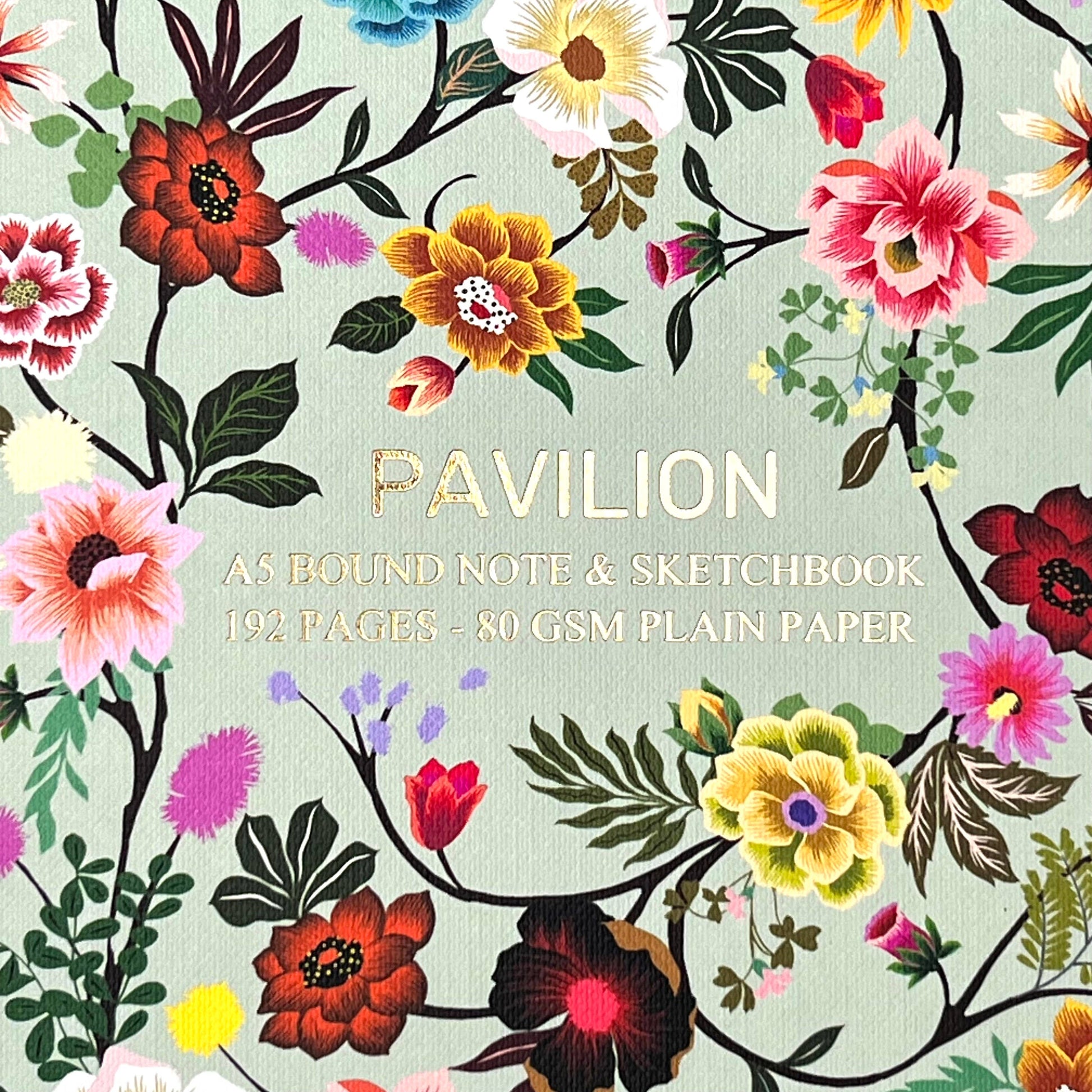 Close up of gold foiled floral details on notebook