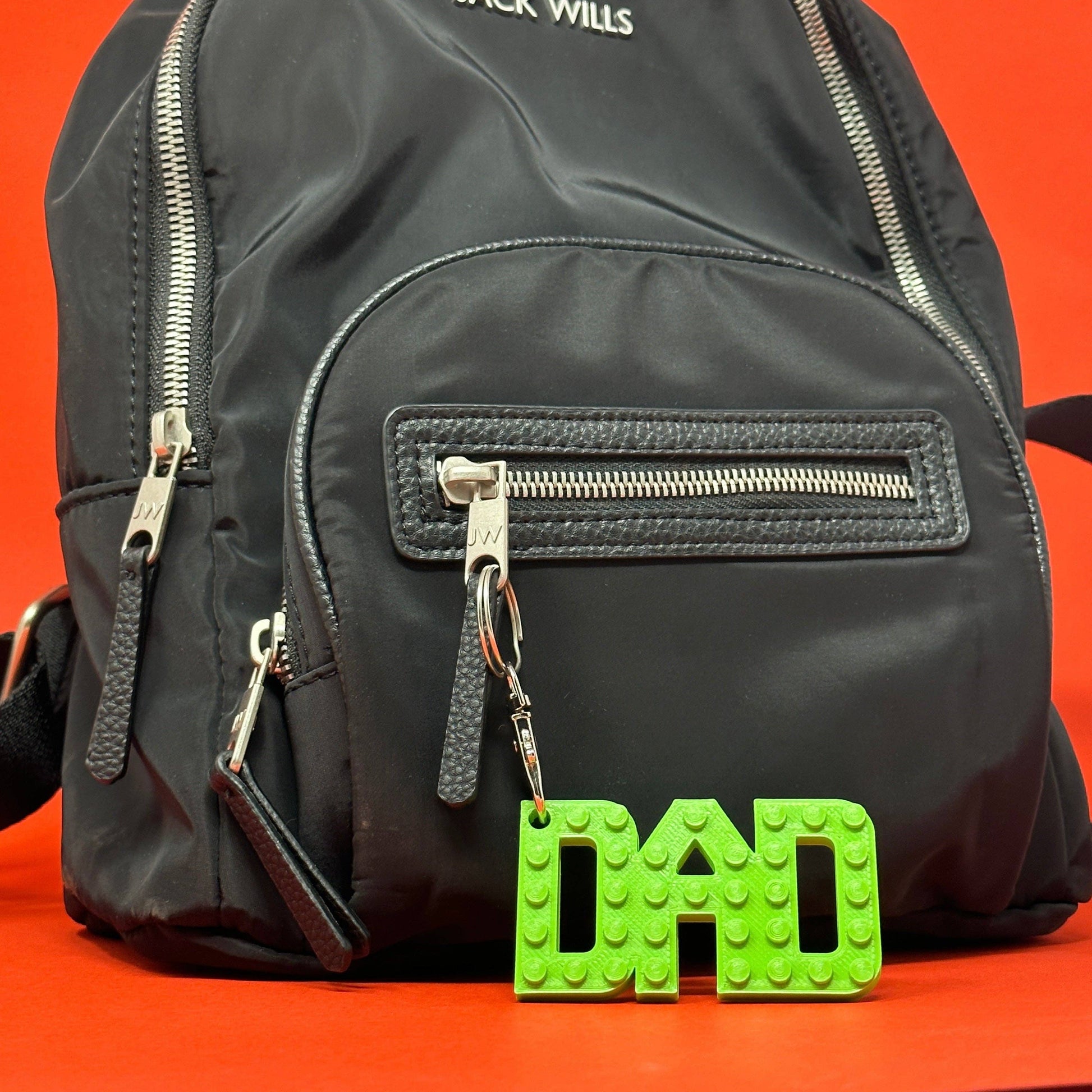 Collection of colourful Dad brick style keyrings