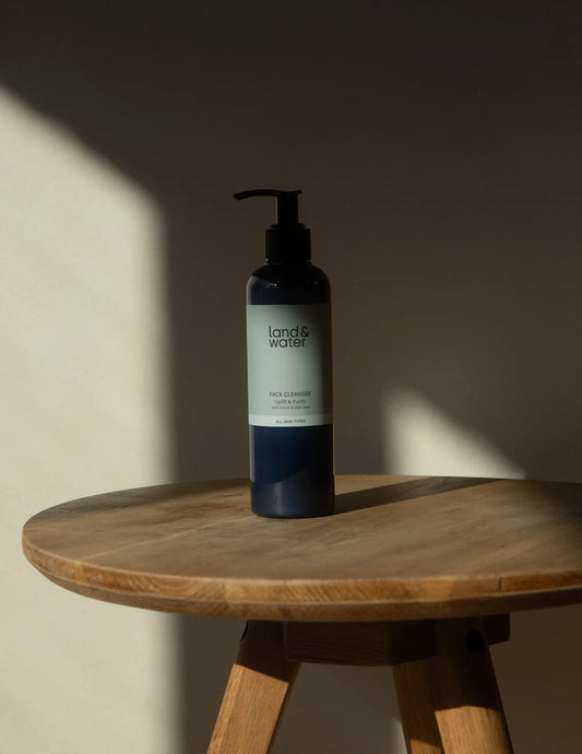 Close-up of Land & Water Uplift & Purify Face Cleanser, highlighting the pump dispenser and natural ingredients.