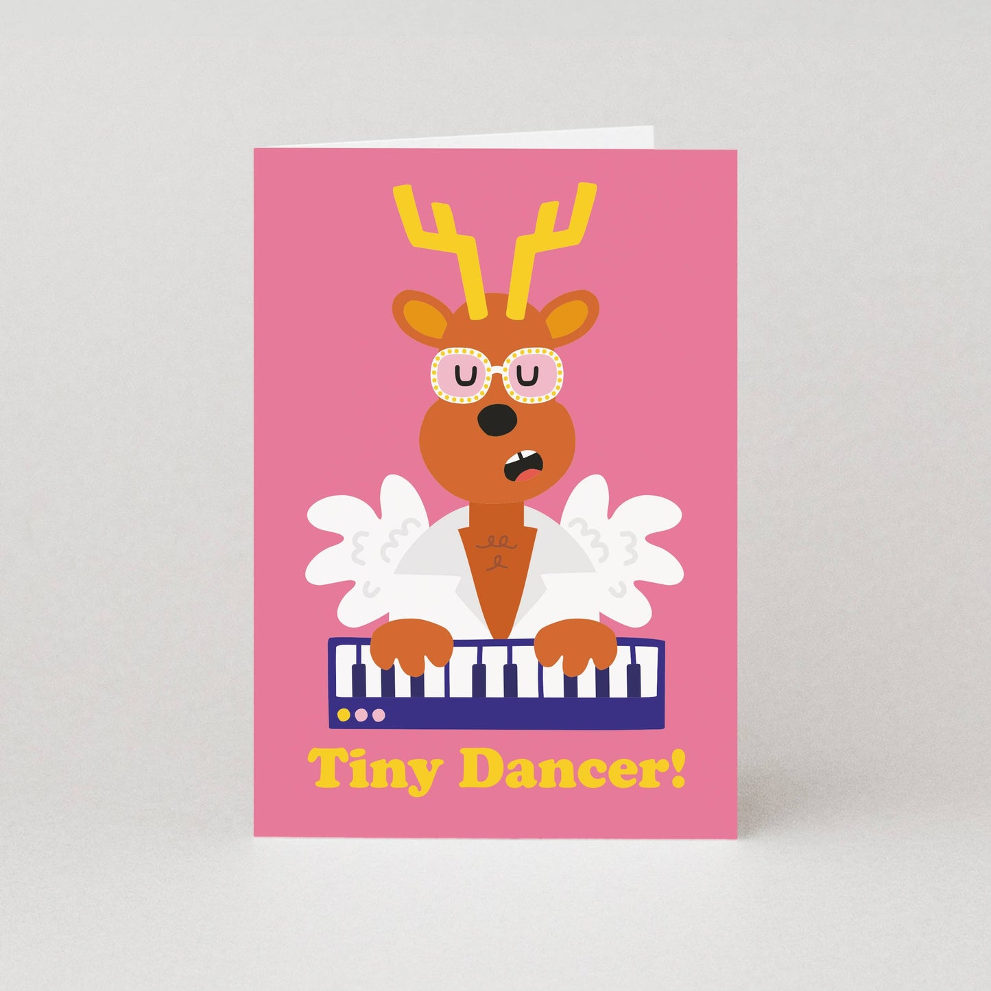 Tiny Dancer Elton John Christmas card featuring a reindeer playing the piano