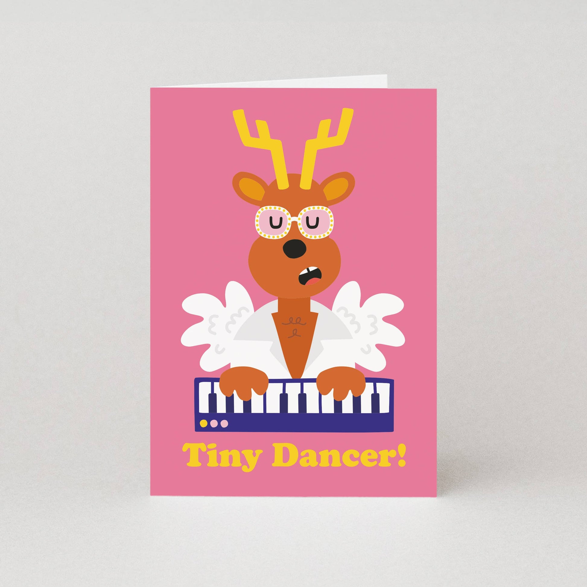 Tiny Dancer Elton John Christmas card featuring a reindeer playing the piano