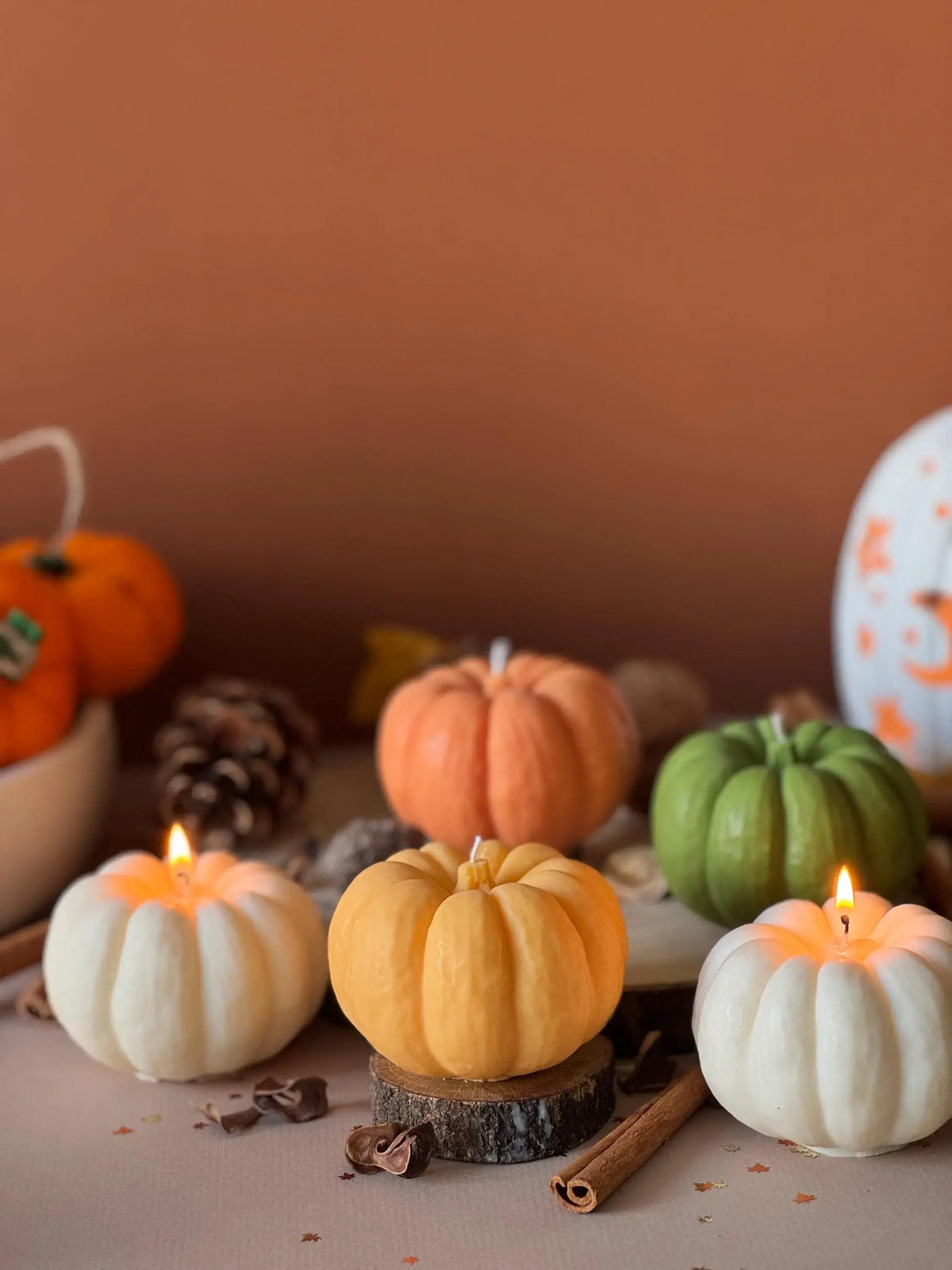 Decorative orange pumpkin candle for autumn styling